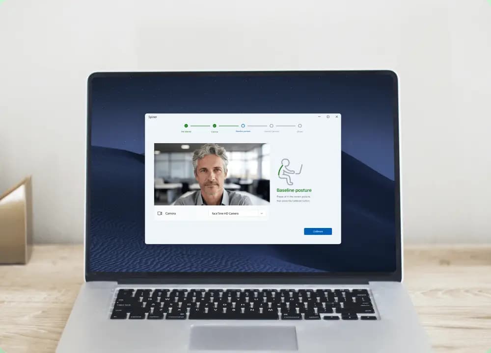 Posture tracking application open on a laptop screen, displaying a webcam feed and baseline posture calibration step